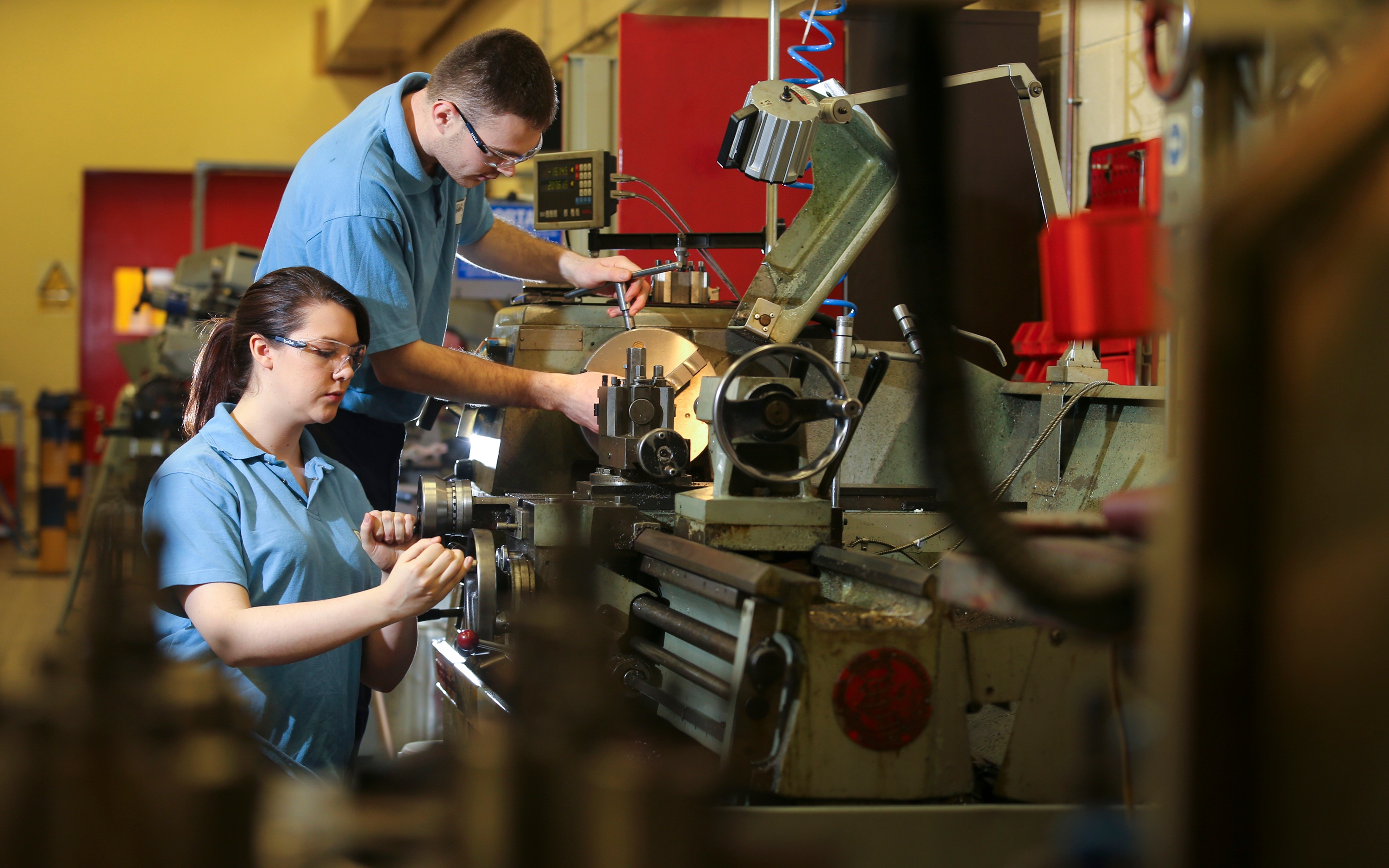 Two people working in a workshop