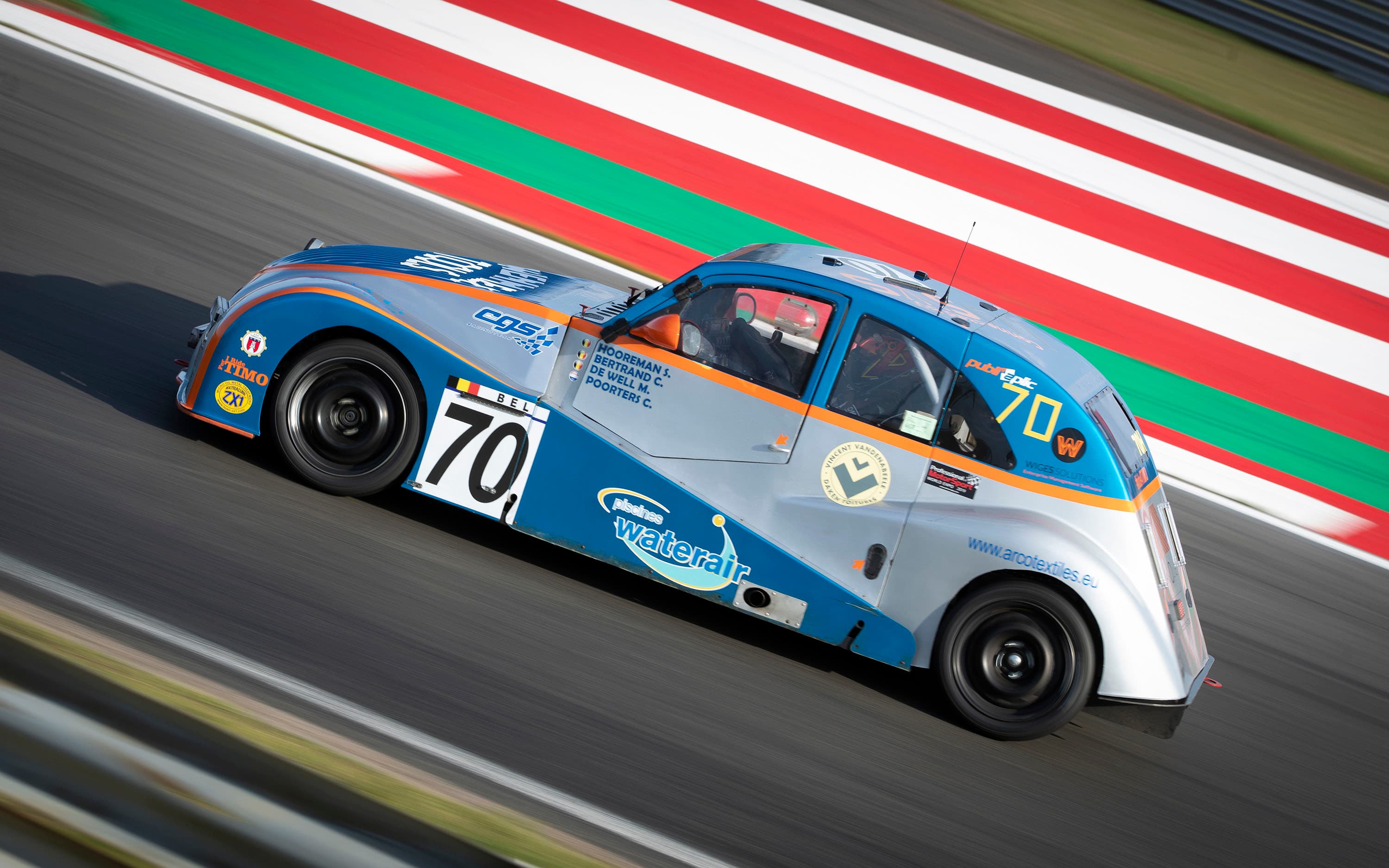 A Citroen 2CV racing on track at Snetterton, Norfolk